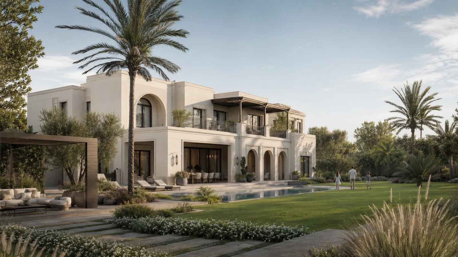 A completed two-storey custom villa with an arched façade overlooking a landscaped garden, pool and mature palms
